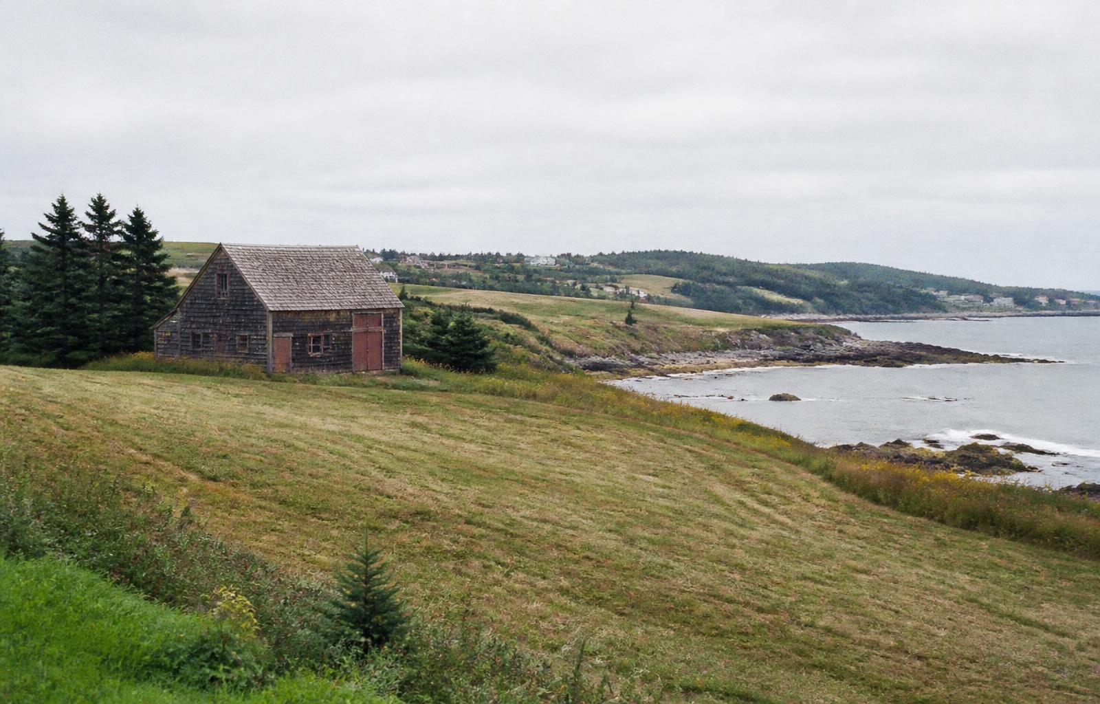 Farmland meeting the Atlantic shoreline in rural Nova Scotia